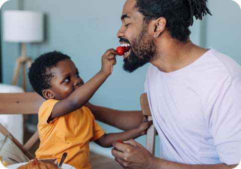 Child feeding father