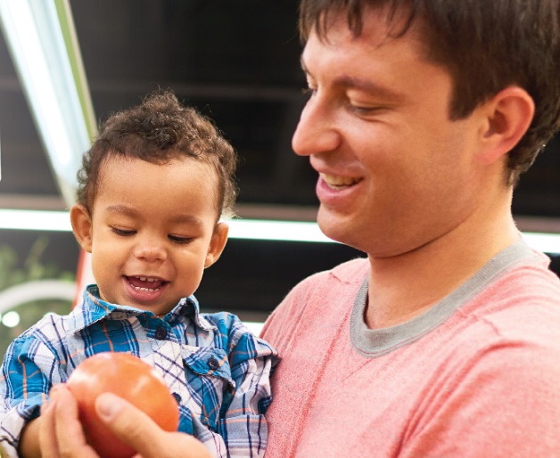 Toddler eating an avacado