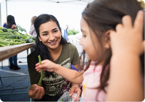 Mother and child at farmers market